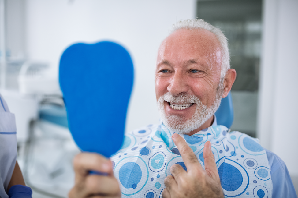 senior-man-dentist-teeth-cleaning